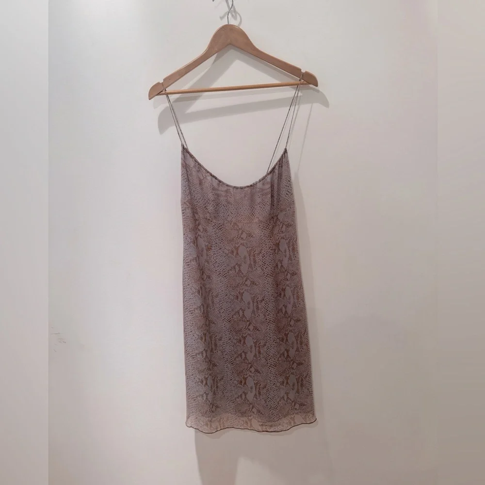 Tahari slip spaghetti strap 100% silk dress. Size 12.
NEWLY dry cleaned. - Picture 1 of 13